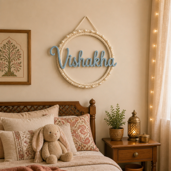 Personalised name hoop with the lettering in sky blue yarn